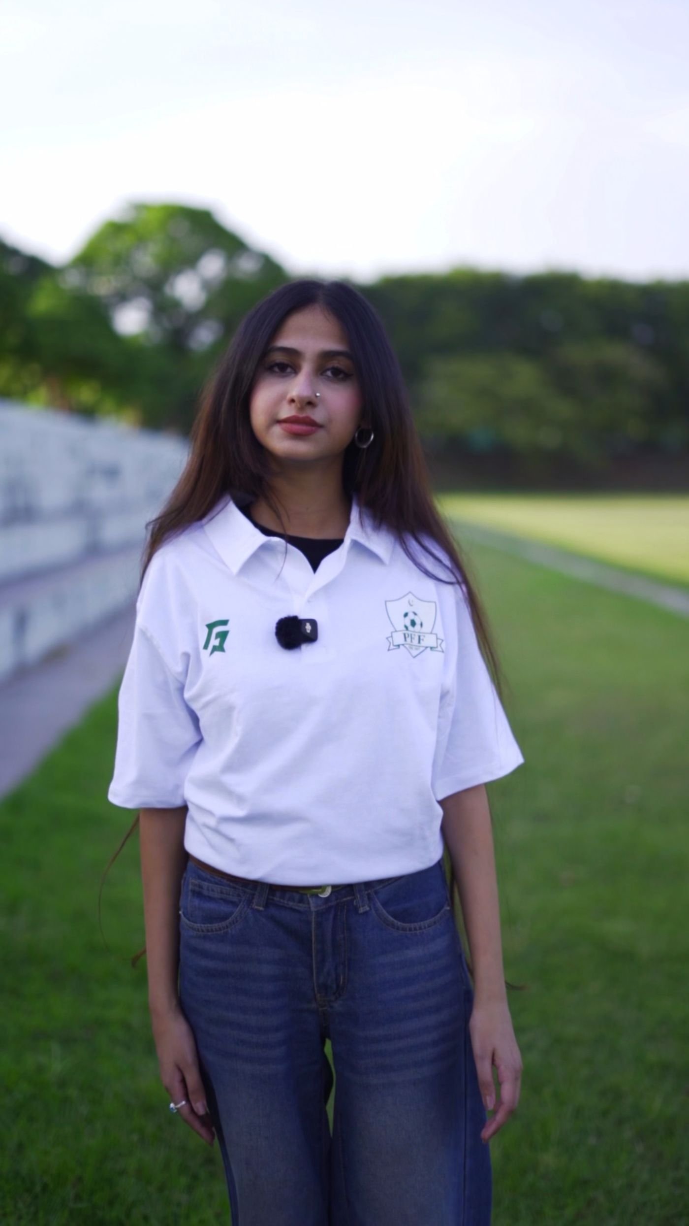Pitch-side presenter in a PFF polo shirt, video reels by Endorse Media